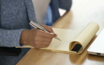 close-up-hand-writing-notebook